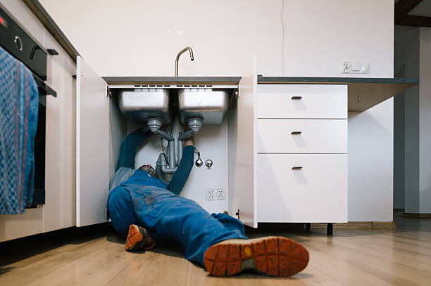 Professional Drain Cleaning technician working in Lake Harbor, FL